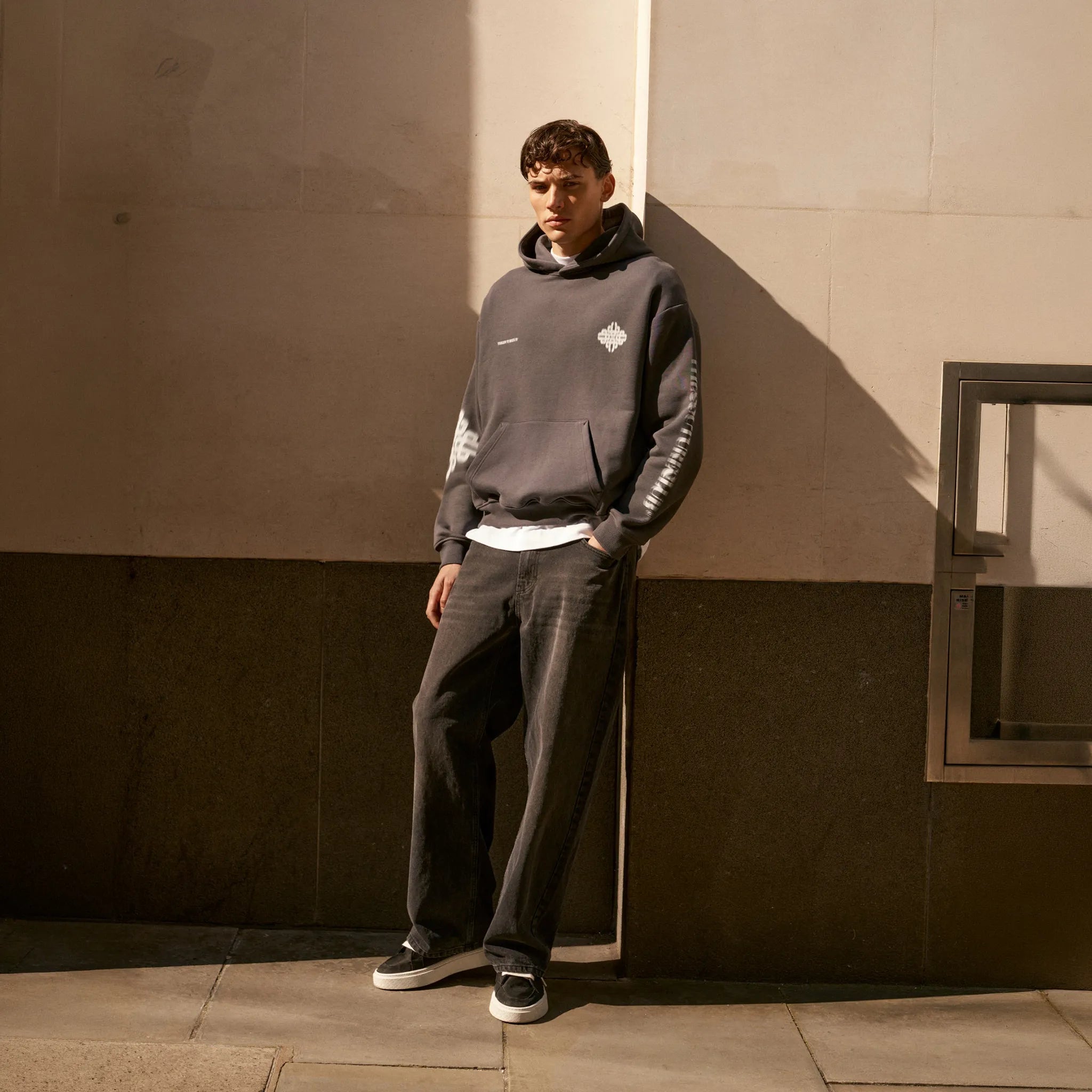 Front View of the couture club motion blurred emblem charcoal hoodie tccm2978